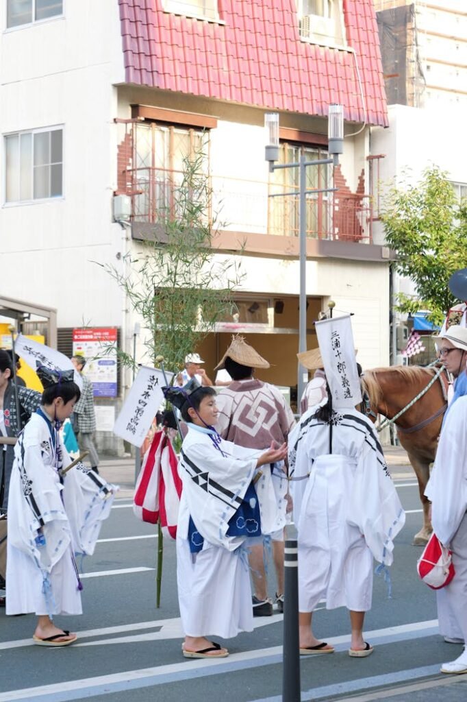 A group of people dressed in traditional clothing and holding a horse