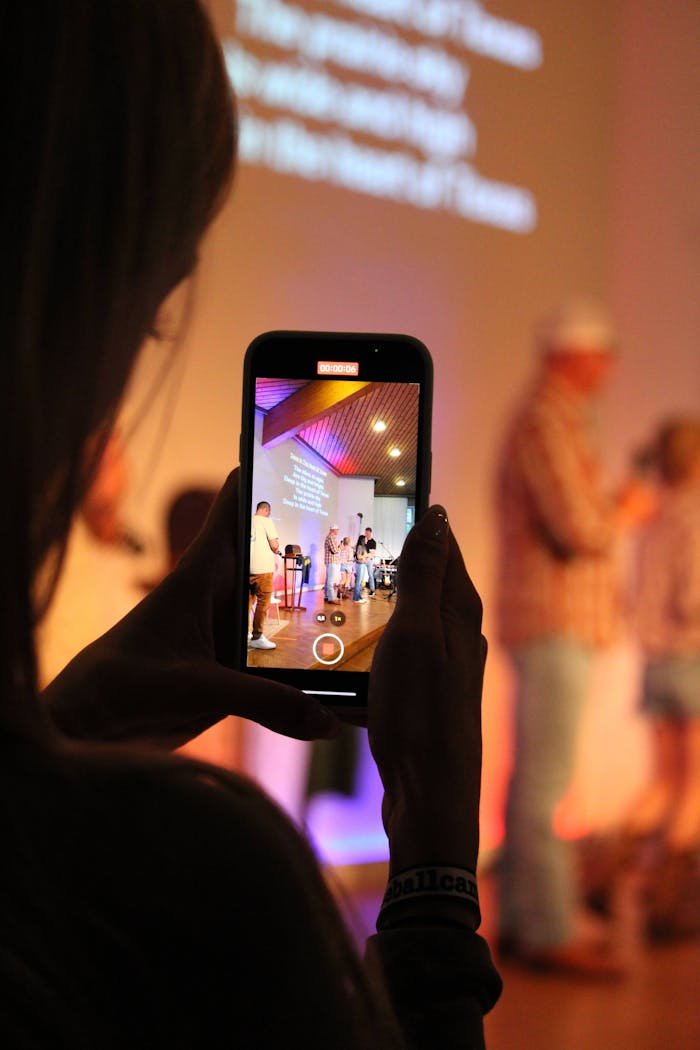 Girl filming with smartphone